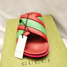 Gucci Rubber Web Womens Criss Cross Slide Sandals Coral New Shamarock. Brand New In A Box Comes With Two Dustbag And Care Card. This Is An Authentic Pair Of Gucci Rubber Web Womens Criss Cross Slide Sandals Size 38 In Coral And New Shamrock. These Stylish Sandals Are Crafted Of Red And Green Rubber. They Feature A Pink Rubber Bottom With A Crossover Band Of Gucci Classic Red And Green Web. Made In Italy Gucci Green Flat Sandals, Green Flat Gucci Sandals, Red Gucci Sandals For The Beach, Gucci Green Summer Sandals, Green Gucci Sandals For Summer, Gucci Green Sandals With Branded Insole, Gucci Green Sandals With Round Toe, Gucci Designer Sandals With Red Sole, Gucci Leather Sandals With Red Sole