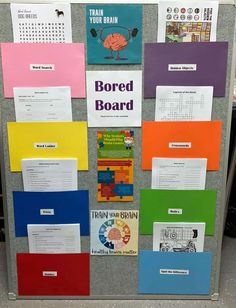 a bulletin board with different colored papers on it