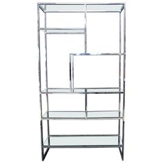 a metal shelf with three sections on each side and one section in the middle, against a white background