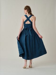 "Summer calls for a crisp dress and this cross-back dress from Linennaive is pretty perfect.  Made from breezy linen, it has comfortable cross back that'll really let skin breathe. Featuring a a classic square neckline and pleated detailing, evoking the laidback rhythms of far-off islands and unexplored landscapes.  It enhance the grace and femininity with a whimsical and flattering flow.  PS: It show very gorgeous and rich colors in sunlight for a truly one-of-a-kind, sophisticated allure. 【Fabric】 100% Linen, around 200g/gram. Medium weight. Every year we have a dedicated team to study the evolution of linen. Linen is a traditional fabric. It seems that linen will not change even if dynasties have changed, and time has passed. Let us add a little imagination and curiosity here. If the ra Linen Midi Dress With Tie Back, Blue A-line Linen Midi Dress, Tie Back Linen Midi Dress, Midi Linen Dress With Tie Back, Midi Length Linen Dress With Tie Back, Blue Linen Midi Dress For Brunch, Elegant Blue Linen Midi Dress, A-line Linen Midi Dress For Garden Party, Blue Fitted Linen Midi Dress