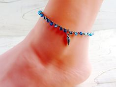 I created this pretty anklet using three shades of silver lined, AB coated blue glass seed beads, tightly crocheting all onto sand colored nylon cord, and finishing with a silver tone spiral seashell charm. Perfect for a fun day in the sun--whether you're at the beach or not! Prefer a different charm? I have lots to choose from - please make your choice from the drop down menu. This dainty yet sturdy anklet comes in three sizes--all with an attached 1-inch silver plated extender chain which can Handmade Blue Anklets For Beach Season, Blue Beaded Bracelets With Silver Beads For Beach, Blue Strand Anklets For Festivals, Silver Anklets With Tiny Beads For Beach, Seashell Anklet, Spiral Seashell, Summer Jewelry Beach, Dragonfly Bracelet, Dragonfly Jewelry