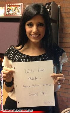 a woman holding up a sign that says will the real rise portrait please stand 90?