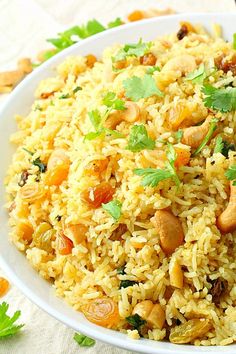 a white bowl filled with rice and vegetables