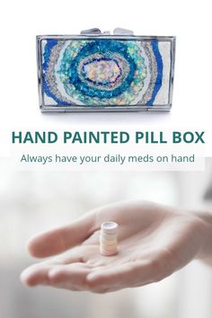 a hand holding a pill box with the words hand painted pill box always have your daily meds on hand