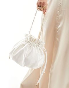 Accessories.by.True Decadence.Bag yourself the ultimate accessory.Pouch design.Chain strap.Drawstring closure.Product Code: 133685877 Evening Cream Crossbody Clutch, Cream Crossbody Clutch For Evening, Cream Pouch Shoulder Bag For Evening, Elegant Shoulder Bag Pouch With Adjustable Strap, White Crossbody Evening Bag For Formal Events, White Crossbody Evening Bag For Formal Occasions, White Evening Bag For Party, Chic Satin Bag For Events, White Pouch Shoulder Bag For Evening