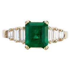 Classic 1960’s vintage rich green Emerald cut Emerald and diamond engagement ring. GIA certified 1.50ct octagonal step cut center emerald set in a 14k yellow gold setting with 6 baguette cut diamonds. 1 octagonal step cut green Emerald, approx. total weight 1.50cts, moderate inclusions, natural F2 clarity enhancement, 6.73 x 6.14 x 4.56mm, GIA certificate #5171016506 6 baguette diamonds, approx. total weight .22cts, H, VS Size 5.25 and sizable 14k yellow gold Tested and stamped: 14k 3.31 grams W Antique Emerald Engagement Ring, Emerald And Diamond Engagement Ring, Emerald Set, Gia Certificate, Emerald Cut Diamond Ring, Yellow Gold Engagement Ring, Step Cut, Baguette Diamonds, Yellow Gold Setting