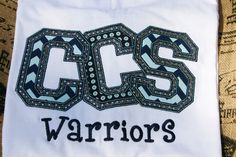 a white towel with the word css warriors on it and an ornate design in black