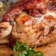 a large piece of meat sitting on top of a wooden cutting board