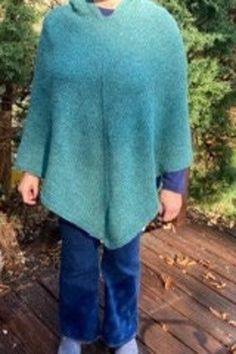 women's hand knit poncho with hood. a lovely turquoise blue green made with 50% llama 50% wool, size L Green Hooded Winter Poncho, Green One Size Winter Poncho, Cozy Hand-knitted Winter Poncho, Cozy One-size Green Poncho, Cozy Hand-knitted Long Sleeve Poncho, Hand Knit Poncho, Ladies Poncho, Knitted Poncho, Bleu Turquoise