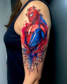 a woman with a spider man tattoo on her arm