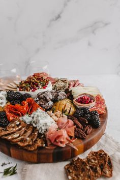 a wooden platter filled with different types of food