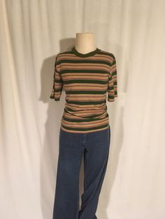 "1960s surf shirt from the 909 Collection 100% cotton striped high crew good vintage collection, light wear labeled size S, fits like a xs/tight s, see below, shoulder-16\" chest-15 3/4\" sleeve-9 3/4\" length-26\"" 70s Fashion Tops, 90s Striped Shirt Outfit, Striped Vintage Shirt, Affordable Vintage Tops For School, Casual Green Tops With Vertical Stripes, 60s Tops Women, Retro Striped Tops With Relaxed Fit, Casual Green Top With Vertical Stripes, Retro Tops With Vertical Stripes And Relaxed Fit