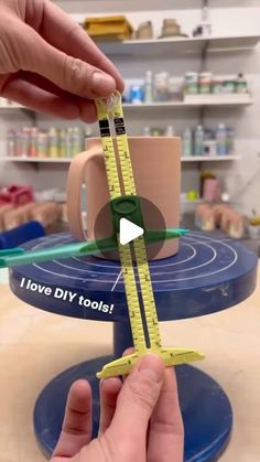 a person holding a measuring tape with the words i love diy tools