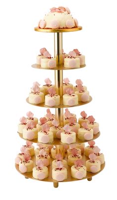 a three tiered cake stand with cupcakes on it's sides and pink frosting in the middle