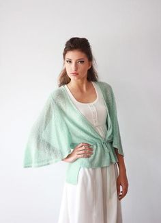 Elegant Green V-neck Cardigan, Chic V-neck Shrug For Spring, Chic V-neck Summer Shrug, Chic V-neck Shrug For Summer, Elegant Open Front Summer Shrug, Elegant Spring Wrap Shrug, Feminine Summer Layering Cardigan, Feminine Summer Cardigan For Layering, Spring Wrap Shrug