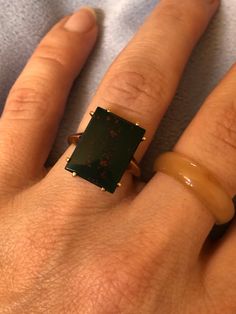 "Hello and Welcome to LiamBySevanna! Prior-purchasing any listing from this shop, please Ask question/s, Request additional photos, to make sure the listed item, is the right choice for you! Per our store policy we don't accept returns Listing is for: 10K Solid Gold Rectangle flat Bloodstone Ring. Size 6.5 weights 4.3 grams. Ring is marked 10K. Bloodstone has very flat top. Set with 8 prongs. Dark green with hues of red within. Reminder: You can \"always\" prevent any wrong purchase/s by Communicating, Inquiring and Questioning Prior making any Purchase! We provide pictures and share any info known about the listing accordingly. Don't assume, please ask. Thank you Kindly." Bloodstone Ring, Gold Flats, Raw Stone, Flats Top, 10k Gold, Gold Style, Solitaire Ring, Beautiful Earrings, Dark Green