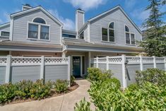 a house with grey siding and white trim