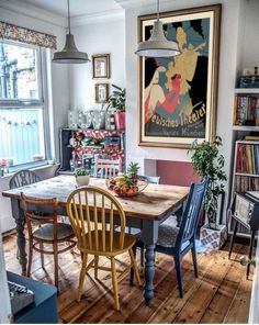 a table and chairs in a small room