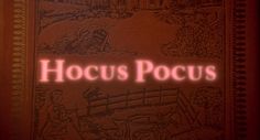 the title for hoccus pocus, written in red on a brown book cover