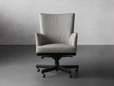 an office chair sitting on top of a gray floor