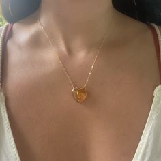 Beautiful AAA Large Citrine Heart Necklaces. 24k gold plated around the edges of the pendant so you can soak in the citrine energy through your skin Choose from 16 or 18 length! Chains are gold fill. Citrine attracts wealth, prosperity and success. It imparts joy, wonder, delight and enthusiasm. Raises self-esteem and self-confidence. Stimulates the brain, strengthening the intellect. Citrine promotes motivation, activates creativity and encourages self-expression Gold Heart-shaped Spiritual Necklace, Gold Spiritual Heart Necklace, Spiritual Gold Heart Necklace, Gold Pendant Heart Necklace With Gemstone, Gold Crystal Necklace With Heart Charm For Gifts, Gold Heart Necklace With Gemstone For Gift, Gold Citrine Necklace For Healing, Spiritual Gold Crystal Necklace For Anniversary, Gold Citrine Pendant Crystal Necklace