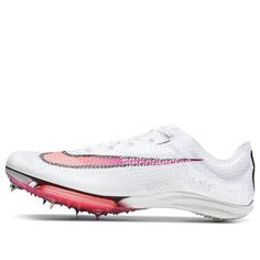 a white and pink shoe with spikes on the bottom, in front of a white background