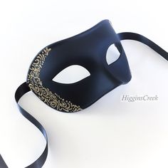 "Elegant Mens Masquerade mask, Custom Mens venetian mask, Black tie Masquerade Ball, Halloween Mens Mask, Black with Gold Mask MORE COLORS Simple and elegant Black Masquerade Masks for Men. The masks can be colored in a variety of shimmers. Picture shown has black with shimmer (Light Gold Shown, Other colors available). S H I P P I N G - Last minute masquerade mask shopping? Processed same day or within 24 hours. 1-2 day guaranteed delivery services offered, add items to cart and click on shippi Black And Gold Masquerade Mask Stick, Black Formal Masquerade Mask For Halloween, Black Formal Eye Mask Masquerade, Formal Black Eye Mask, Black Formal Eye Mask, Black Venetian Masquerade Mask, Venetian Formal Eye Mask, Elegant Black Formal Mask, Venetian Masquerade Mask For Halloween Formal