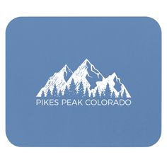 the pikes peak colorado logo is shown on a blue mousepad with white mountains in the background