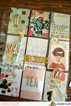 many different types of greeting cards are arranged on a table with scissors and other items