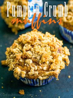 pumpkin crumb muffins in blue paper cups on a black surface with text overlay