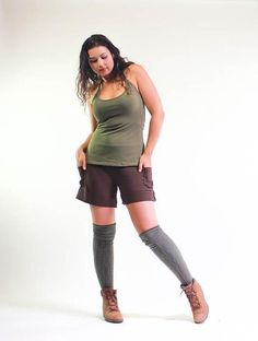 Available Colors and SizesBlack: S,M,LSage Green: S,M,LChocolate Brown: S,M,L1st cousin to our best selling Yoga Cargo pants, these shorts are versatile, comfortable and flattering. The classic yoga fold down waist is combined with a drawstring for added security. These shorts can be high waisted, mid rise or hip huggers. You decide. Small cargo pockets on both sides sit just above the folded up cuffs, adding to practicality and style. Snug fitting on the waist and hips, flaring slightly into th Casual Brown Athletic Shorts With Built-in Shorts, Khaki Athletic Shorts With Built-in Liner, Casual Brown Stretch Athletic Shorts, Fitted Above Knee Cotton Bottoms, Above Knee Athletic Shorts For Yoga In Summer, Fitted Cotton Yoga Shorts, Summer Yoga Athletic Shorts Above Knee, Above Knee Athletic Shorts For Yoga, Casual Mid-thigh Yoga Shorts