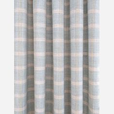 a close up view of a curtain with plaid pattern