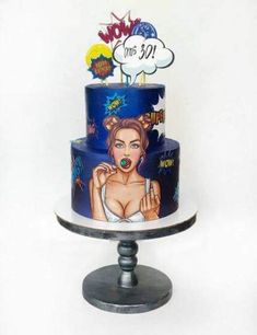 there is a blue cake with an image of a woman on the front and bottom