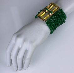 For Sale on 1stDibs - Wonderful Trifari Art Deco bracelet by Alfred Phillipe of faux emerald beads with a apple juice bakelite buckle clasp designed to resemble citrine. Emerald Luxury Green Rectangular Bracelets, Green Rectangular Bracelet For Formal Occasions, Green Rectangular Bracelets For Formal Occasions, Formal Green Rectangular Bracelets, Formal Green Rectangular Bracelet, Elegant Green Beaded Bracelets For Formal Events, Elegant Green Beaded Bracelets For Formal Occasions, Wide Art, Art Deco Bracelet