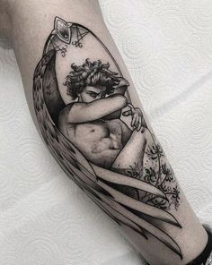 an artistic tattoo design on the arm of a woman with wings and flowers in her hair