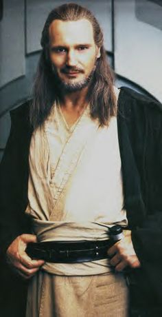 a man with long hair wearing a robe