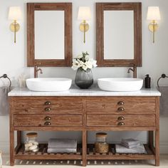 two sinks and mirrors in a bathroom with wood accents on the vanity, along with rugs