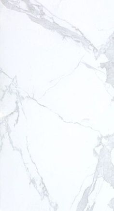 a white marble counter top with grey veining