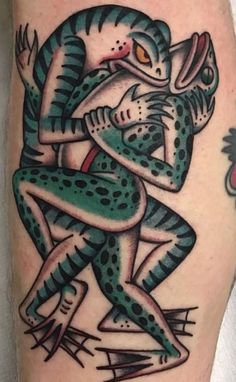 a tattoo with two people hugging each other on the arm and one is holding an animal