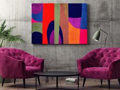 two purple chairs sitting next to each other in front of a painting on the wall