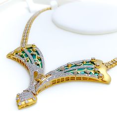 This exquisite 18k yellow gold necklace set, weighing 48.7 grams, features a luxurious Meena design adorned with dazzling diamonds. The yellow gold finish enhances its elegant appeal, making it perfect for any special occasion. The set includes a necklace with a total diamond weight of 3.31 carats, featuring F-G color and VS quality diamonds. Ideal for those who appreciate high-quality craftsmanship and timeless beauty, this Meena diamond set is a cherished addition to any jewelry collection. PR Luxury Gold Necklaces With Cut Dana, Luxury Exquisite Yellow Gold Diamond Necklace, Yellow Gold Hand-set Diamond Necklace For Celebration, Luxury Meenakari Gold Plated Necklaces, Luxury Yellow Gold Diamond-shaped Necklace, Luxury Gold Multi-stone Necklace, Luxury 14k Gold Multi-stone Necklace, Lock Style, 18k Gold Necklace