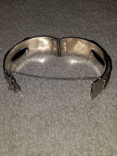 "I will combine shipping on all purchases and refund any overages after shipping fees and insurance. In beautiful vintage condition. Clearly stamped. Fancy ornate design on the silver tone metal with 2 large Hematite stones (one on top and one on bottom) Approximately 7\". Please look at the pictures for details and condition or message me with any questions" Ornate Adjustable Cuff Bracelet For Formal Occasions, Adjustable Ornate Bangle For Formal Occasions, Silver Bangle Cuff Bracelet For Formal Occasions, Victorian Style Silver Bracelets For Formal Occasions, Formal Antique Silver Bracelets, Antique Silver Metal Bracelet, Antique Silver Metal Bracelets, Antique Hinged Cuff Bracelet For Formal Occasions, Victorian Style Silver Bracelet For Formal Occasions