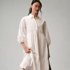 The Bettina Tiered Shirt Dress: Eyelet Edition Elegant Shirt Dress For Daywear In Spring, Elegant Long Sleeve Shirt Dress For Garden Party, Elegant Shirt Dress For Garden Party In Spring, Feminine Formal Shirt Dress For Spring, Feminine Shirt Dress For Dress Down Spring Occasion, Feminine Shirt Dress For Spring, Elegant Shirt Dress For Garden Party, Spring Feminine Casual Shirt Dress, Fitted Feminine Shirt Dress For Daywear