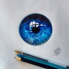 a blue eye with the word instagram written on it and a pencil next to it