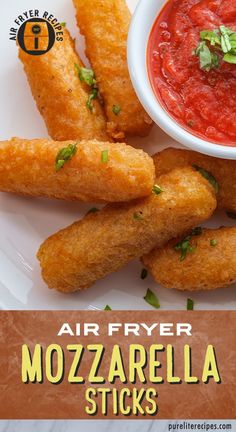 air fryer mozzarella sticks on a plate with tomato sauce and parsley