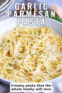 garlic parmesan pasta in a white bowl with text overlay that reads, creamy pasta that the whole family will love