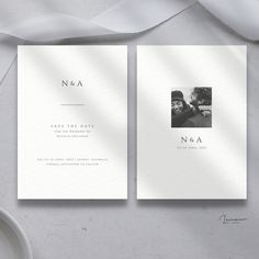 two wedding cards with the same photo on them, one in white and one in black