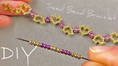 someone is making beaded bracelets with gold and purple beads on the end of a needle