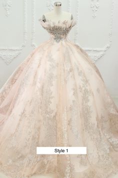 a ball gown on display in front of a white wall