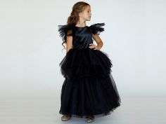 Introducing our Gotic  Dress for Girls, the perfect choice for Halloween enchantment. Crafted from silky and soft black chiffon, this dress captures the essence of Gothic with style. It's an ideal toddler girl dress and a Halloween costume that will make your little one look like a true Halloween princess. 🎃 Key Features: Toddler Plaid Dress Baby 1st Christmas Outfit Girls Holiday Outfit Silky Chiffon Dress Open Back Design Fluffy Two-Tiered Skirt Fully Lined for Comfort This little black dress Black Princess Dress For Dress-up, Black Witchy Dress For Cosplay, Black Dress For Halloween Costume Party, Black Witchy Costume Dress, Black Halloween Costumes For Dress-up, Gothic Ruffled Costumes For Parties, Witchy Ruffled Dress For Costume Party, Gothic Ruffles Party Costumes, Witchy Costume Dresses With Ruffles